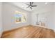 Bright office space with a fan, hardwood flooring and natural light at 5130 Travers Ln, Cumming, GA 30040