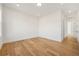 Neutral room with hardwood floors, recessed lighting, and access to the hallway at 5130 Travers Ln, Cumming, GA 30040