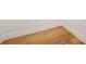 A close up on the beautiful hardwood floors and clean baseboards at 5130 Travers Ln, Cumming, GA 30040