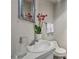 Cozy bathroom featuring vanity, toilet, and decorative mirror at 957 Piedmont Ne Ave # A, Atlanta, GA 30309