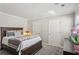 Bright bedroom featuring a wooden bed frame, large dresser and two closets at 957 Piedmont Ne Ave # A, Atlanta, GA 30309