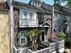 Charming two-story townhome features a welcoming front porch and classic architectural details at 957 Piedmont Ne Ave # A, Atlanta, GA 30309