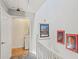 Second floor hallway featuring a washing machine and paintings on the wall at 957 Piedmont Ne Ave # A, Atlanta, GA 30309