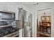 Kitchen area with stainless steel appliances next to the dining room at 957 Piedmont Ne Ave # A, Atlanta, GA 30309