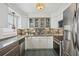 Well-lit kitchen with stainless steel appliances, granite countertops, and stylish backsplash at 957 Piedmont Ne Ave # A, Atlanta, GA 30309