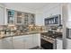 Stylish kitchen featuring stainless steel appliances, granite countertops, and modern cabinetry at 957 Piedmont Ne Ave # A, Atlanta, GA 30309