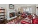 Cozy living room features a fireplace, hardwood floors, and a dining area at 957 Piedmont Ne Ave # A, Atlanta, GA 30309