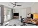 Bright office with a ceiling fan, desk, and a door to the balcony at 957 Piedmont Ne Ave # A, Atlanta, GA 30309