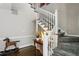 Elegant staircase with white railings and hardwood steps, complemented by stylish decor at 957 Piedmont Ne Ave # A, Atlanta, GA 30309