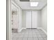 Finished basement area with tile floor, closet, and an attached bathroom with tub and shower at 1085 Crown River Pkwy, Mcdonough, GA 30252