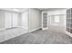 Spacious basement with new carpet and adjacent tiled area with closet at 1085 Crown River Pkwy, Mcdonough, GA 30252