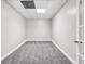 A finished bedroom with carpeting, recessed lighting, and a door to another room at 1085 Crown River Pkwy, Mcdonough, GA 30252