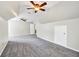 Bonus room with neutral walls, plush carpeting, modern fan, and unique architecture at 1085 Crown River Pkwy, Mcdonough, GA 30252