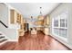 Open concept kitchen with light wood cabinets, stainless steel appliances and hardwood floors at 1085 Crown River Pkwy, Mcdonough, GA 30252