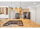 Spacious kitchen with stainless steel appliances and a large center island cooktop at 1085 Crown River Pkwy, Mcdonough, GA 30252