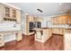 Gourmet kitchen with custom cabinets, an island, and stainless steel appliances at 1085 Crown River Pkwy, Mcdonough, GA 30252