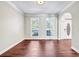 Spacious living room featuring hardwood floors, natural light, and neutral paint at 1085 Crown River Pkwy, Mcdonough, GA 30252