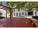 Spacious backyard featuring a wooden deck, pergola, and a view of the home's exterior at 2648 Kenwood Dr, Duluth, GA 30096