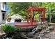 Beautiful yard with a deck, pergola, water feature, grill, and outdoor seating at 2648 Kenwood Dr, Duluth, GA 30096