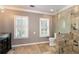 Bathroom with stone floors, dual windows, and a glass shower at 2648 Kenwood Dr, Duluth, GA 30096