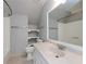 Bright bathroom featuring a sleek vanity, a toilet, and a shower with a shower curtain at 2648 Kenwood Dr, Duluth, GA 30096