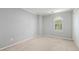Neutral bedroom featuring plush carpeting, window, and a closet at 2648 Kenwood Dr, Duluth, GA 30096
