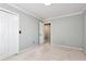 Neutral bedroom featuring plush carpeting, white trim, and closet space at 2648 Kenwood Dr, Duluth, GA 30096