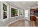 Cozy breakfast nook featuring three large windows and wood floors at 2648 Kenwood Dr, Duluth, GA 30096