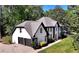 Stately two-story home with a well-manicured lawn and a two-car garage, framed by lush trees at 2648 Kenwood Dr, Duluth, GA 30096