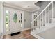 Bright foyer with hardwood flooring, staircase, and a front door that brings in natural light at 2648 Kenwood Dr, Duluth, GA 30096