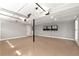 Spacious garage with epoxy flooring, and a well-lit and organized storage system at 2648 Kenwood Dr, Duluth, GA 30096