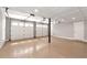 Clean garage featuring epoxy flooring, bright lighting, and two white garage doors at 2648 Kenwood Dr, Duluth, GA 30096