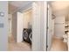 Hallway view with laundry machines, and the entrance to the bathroom at 2648 Kenwood Dr, Duluth, GA 30096