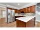 Spacious kitchen features an island, stainless steel appliances, and dark wood cabinets at 2648 Kenwood Dr, Duluth, GA 30096