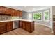 The kitchen boasts an island, dark cabinets, stainless steel appliances, and tiled backsplash at 2648 Kenwood Dr, Duluth, GA 30096