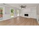 Spacious living room featuring a fireplace, built-in shelving, and hardwood floors at 2648 Kenwood Dr, Duluth, GA 30096