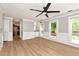 Open-concept living area with hardwood floors and a view of the outdoor deck through large windows at 2648 Kenwood Dr, Duluth, GA 30096