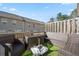 Outdoor deck area featuring comfortable patio furniture, artificial turf, and privacy fencing for relaxing and entertaining at 2709 Kemp Court, Conyers, GA 30094