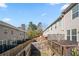 Enclosed backyard with wooden fencing and a deck, providing a private outdoor space for relaxation and recreation at 2709 Kemp Court, Conyers, GA 30094
