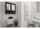 Cozy bathroom with toilet, vanity and framed mirror at 2709 Kemp Court, Conyers, GA 30094