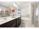 Bathroom with double vanity, soaking tub, walk-in shower, and modern finishes at 2709 Kemp Court, Conyers, GA 30094