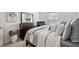Comfortable bedroom features a well-made bed, soft pillows, side tables, and decorative accents for a relaxing retreat at 2709 Kemp Court, Conyers, GA 30094