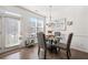 Cozy dining area with modern lighting, stylish chairs, and access to outdoor space at 2709 Kemp Court, Conyers, GA 30094