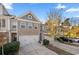 Charming townhome with a two-car garage, brick facade, and well-maintained landscaping at 2709 Kemp Court, Conyers, GA 30094