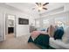 Spacious main bedroom with trey ceiling, carpet floors and ensuite bathroom at 2709 Kemp Court, Conyers, GA 30094
