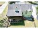 Aerial view of a two-story home with a screened-in porch and fenced backyard at 4066 Harvest Ridge Dr, Douglasville, GA 30135