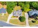 An aerial shot captures the house, showcasing its surrounding lawn, driveway, and neighborhood at 4066 Harvest Ridge Dr, Douglasville, GA 30135