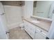 Bright bathroom featuring granite countertop vanity and shower-tub combination at 4066 Harvest Ridge Dr, Douglasville, GA 30135