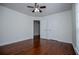 Spacious bedroom with hardwood floors, ceiling fan, and ample closet space at 4066 Harvest Ridge Dr, Douglasville, GA 30135