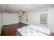 Large bedroom with hardwood floors, ceiling fan, and two windows at 4066 Harvest Ridge Dr, Douglasville, GA 30135
